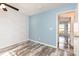 Bedroom with wood-look floors and a ceiling fan at 12250 Wallace Ridge Dr, Charlotte, NC 28269