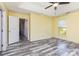 Spacious bedroom with a ceiling fan and two windows providing natural light at 12250 Wallace Ridge Dr, Charlotte, NC 28269