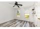 Bedroom with two windows and wood-look floors at 12250 Wallace Ridge Dr, Charlotte, NC 28269