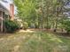 Expansive grassy backyard with a wooded perimeter that offers ample privacy at 13101 Kensworth Ct, Charlotte, NC 28277