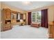 Bedroom with unique headboard design, natural light, and neutral carpeting at 13101 Kensworth Ct, Charlotte, NC 28277