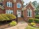 Charming brick home featuring a well-manicured yard and inviting front entrance at 13101 Kensworth Ct, Charlotte, NC 28277