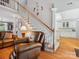 Bright foyer with staircase leading to the upper level and view of the kitchen at 13101 Kensworth Ct, Charlotte, NC 28277