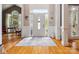 Bright foyer with hardwood floors, paneled walls and a white front door with sidelights at 13101 Kensworth Ct, Charlotte, NC 28277