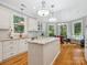 Bright open kitchen featuring granite countertops, an island, stainless appliances, and a breakfast nook at 13101 Kensworth Ct, Charlotte, NC 28277