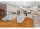 Modern kitchen with white cabinets, granite countertops, stainless steel appliances, and island at 13101 Kensworth Ct, Charlotte, NC 28277