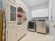 Laundry room with front load washer and dryer plus ample storage space at 13101 Kensworth Ct, Charlotte, NC 28277