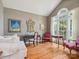 Cozy living room with hardwood floors, vaulted ceiling and large windows providing natural light at 13101 Kensworth Ct, Charlotte, NC 28277