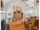 Open living room with vaulted ceiling, fireplace, and comfortable seating area at 13101 Kensworth Ct, Charlotte, NC 28277