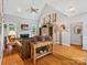 Inviting living room with vaulted ceiling, fireplace, and comfortable seating area at 13101 Kensworth Ct, Charlotte, NC 28277