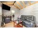 Bonus room with bar, comfortable seating and mounted TV for entertainment at 13510 Brandon Trail Dr, Charlotte, NC 28213