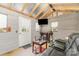 Finished bonus room with mounted TV, bar, mini-split system, comfortable seating and custom lighting at 13510 Brandon Trail Dr, Charlotte, NC 28213