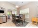Bright dining area with modern chairs, large window, and easy access to the living space at 13510 Brandon Trail Dr, Charlotte, NC 28213