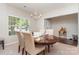 Inviting dining room features a chandelier and ample natural light from the large window at 13510 Brandon Trail Dr, Charlotte, NC 28213