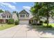 Charming two-story home with a two-car garage, brick accents, and well-manicured landscaping at 13510 Brandon Trail Dr, Charlotte, NC 28213