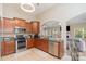 Well-equipped kitchen with stainless steel appliances, ample counter space, and a breakfast bar at 13510 Brandon Trail Dr, Charlotte, NC 28213