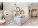 Spacious living room featuring an archway, comfortable seating, and neutral decor at 13510 Brandon Trail Dr, Charlotte, NC 28213
