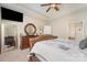 Comfortable main bedroom featuring neutral tones, ceiling fan and a large mirror on the left wall at 13510 Brandon Trail Dr, Charlotte, NC 28213
