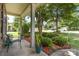 Inviting front porch featuring beautiful landscaping and a cozy seating area at 13510 Brandon Trail Dr, Charlotte, NC 28213