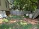 Overgrown backyard featuring a wooden fence and mature trees offering lots of shade at 1355 Oak Breeze Dr, Mooresville, NC 28115