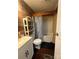 Bathroom featuring a tub and shower with wood paneled walls at 1355 Oak Breeze Dr, Mooresville, NC 28115