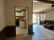 View of the living room leading into the adjacent kitchen, with wood-look floors at 1355 Oak Breeze Dr, Mooresville, NC 28115