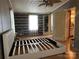 Main bedroom featuring light floors, fan and closet with built in shoe rack at 1355 Oak Breeze Dr, Mooresville, NC 28115