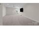 Spacious bonus room with plush carpeting, a ceiling fan, and a large window to provide natural light at 152 Riverstone Dr, Davidson, NC 28036