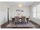 Elegant dining room with tray ceiling, modern chandelier, and stylish decor at 152 Riverstone Dr, Davidson, NC 28036