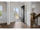 Bright foyer featuring hardwood floors and a view of the home's exterior through the open front door at 152 Riverstone Dr, Davidson, NC 28036
