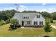 Beautiful single-Gathering home with a manicured lawn and a welcoming front porch at 152 Riverstone Dr, Davidson, NC 28036
