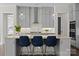 Open kitchen with a center island, pendant lighting, seating, and gray cabinetry at 152 Riverstone Dr, Davidson, NC 28036