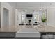 Kitchen featuring an island with a sink and dishwasher, offering views to an open living area at 152 Riverstone Dr, Davidson, NC 28036