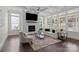 A beautifully furnished living room with hardwood floors, neutral decor and coffered ceilings at 152 Riverstone Dr, Davidson, NC 28036