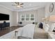 The main bedroom is spacious with hardwood floors, large windows, and a bench beneath the windows at 152 Riverstone Dr, Davidson, NC 28036