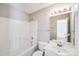 Clean bathroom featuring a tub-shower combo and a white vanity with sink at 1703 Southwind Dr, Charlotte, NC 28216