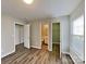 Cozy bedroom with hardwood flooring, closet, and ensuite bathroom at 1703 Southwind Dr, Charlotte, NC 28216