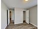 Bright bedroom boasting modern floors, neutral walls, and ample closet space, creating a comfortable retreat at 1703 Southwind Dr, Charlotte, NC 28216
