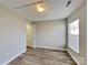 A minimalist bedroom featuring hardwood flooring and a neutral color palette, offering a tranquil and inviting atmosphere at 1703 Southwind Dr, Charlotte, NC 28216