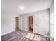 Bright bedroom with view to closet and bathroom at 1703 Southwind Dr, Charlotte, NC 28216