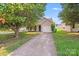 Charming single-story home features a one-car garage, well-maintained lawn, and welcoming curb appeal at 1703 Southwind Dr, Charlotte, NC 28216