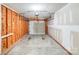 Spacious garage with unfinished walls and an automatic door at 1703 Southwind Dr, Charlotte, NC 28216