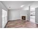 Open-concept living room with fireplace, wood-look floors, seamlessly flows into the kitchen at 1703 Southwind Dr, Charlotte, NC 28216