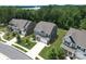 An aerial shot showcasing the house, complemented by manicured lawns and tree-lined streets in a vibrant neighborhood at 17718 Terryglass Ln, Charlotte, NC 28278