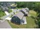 Aerial view of backyard with patio, fire pit, and well-maintained lawn in a desirable neighborhood at 17718 Terryglass Ln, Charlotte, NC 28278