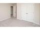 Bedroom featuring double door closet, neutral carpet, and neutral walls at 17718 Terryglass Ln, Charlotte, NC 28278