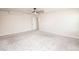 Spacious, neutral bedroom with two windows, neutral carpet, ceiling fan, and light colored walls at 17718 Terryglass Ln, Charlotte, NC 28278