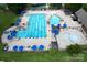 Aerial view of a large community pool with ample seating and a wading area for children at 17718 Terryglass Ln, Charlotte, NC 28278