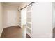 Inviting foyer with sliding barn doors and hardwood floors, creating a stylish and welcoming entrance at 17718 Terryglass Ln, Charlotte, NC 28278