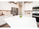 Bright kitchen featuring white countertops and cabinetry, stainless steel appliances, and an island with seating at 17718 Terryglass Ln, Charlotte, NC 28278